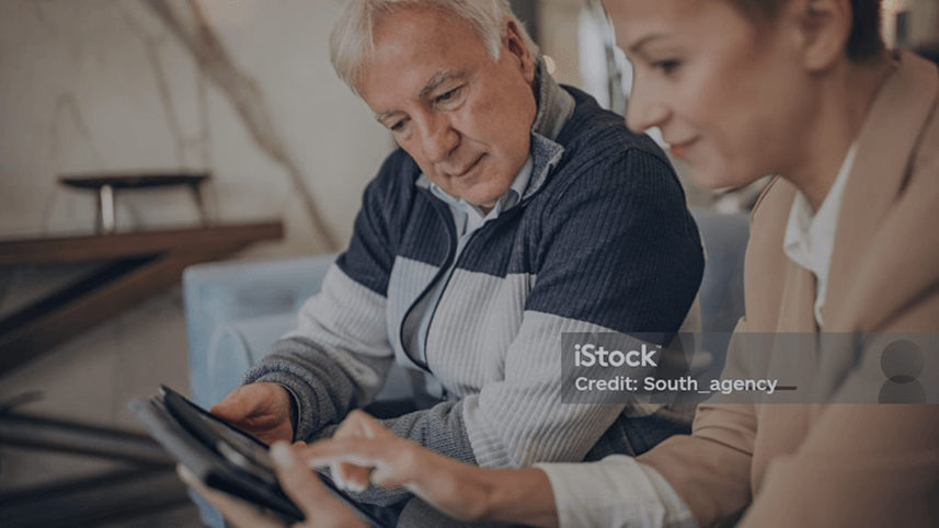 two people viewing a tablet